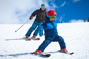 father and son skiing
