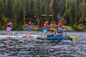 Family stand up paddle boarding at Donner Lake