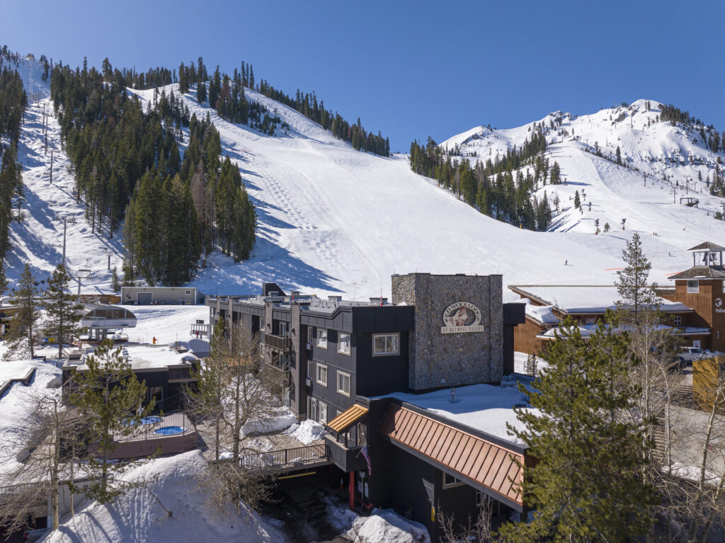 view of red wolf lodge at olympic valley and snowy mountains