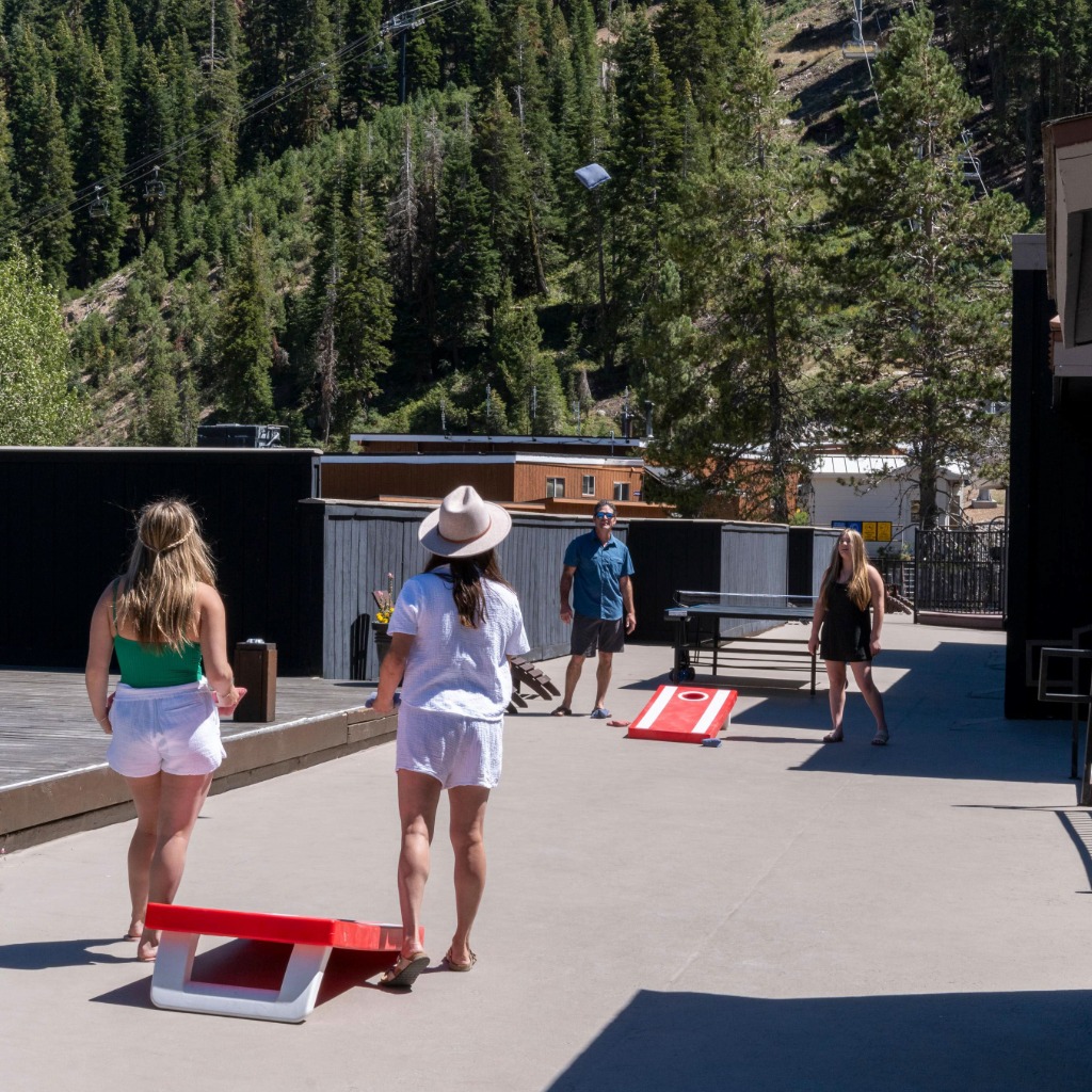 Family playing table tennis at red wolf lodge Olympic valley property