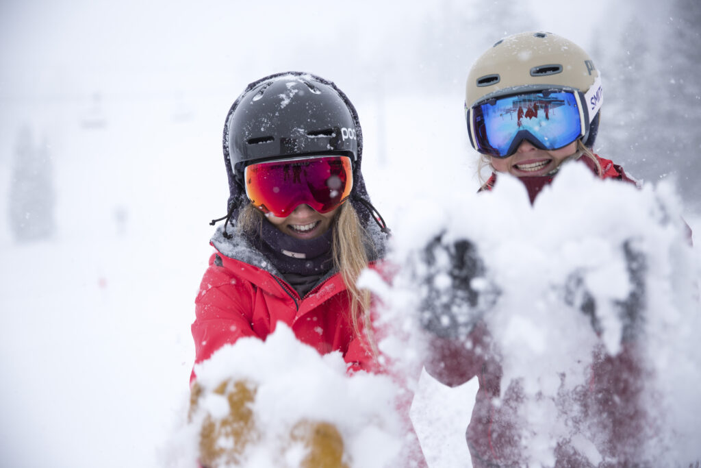 People in ski gear enjoying the snow at Palisades Tahoe